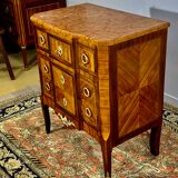 Transition style chest of drawers in rosewood and violet wood, ebony and gilded bronzes