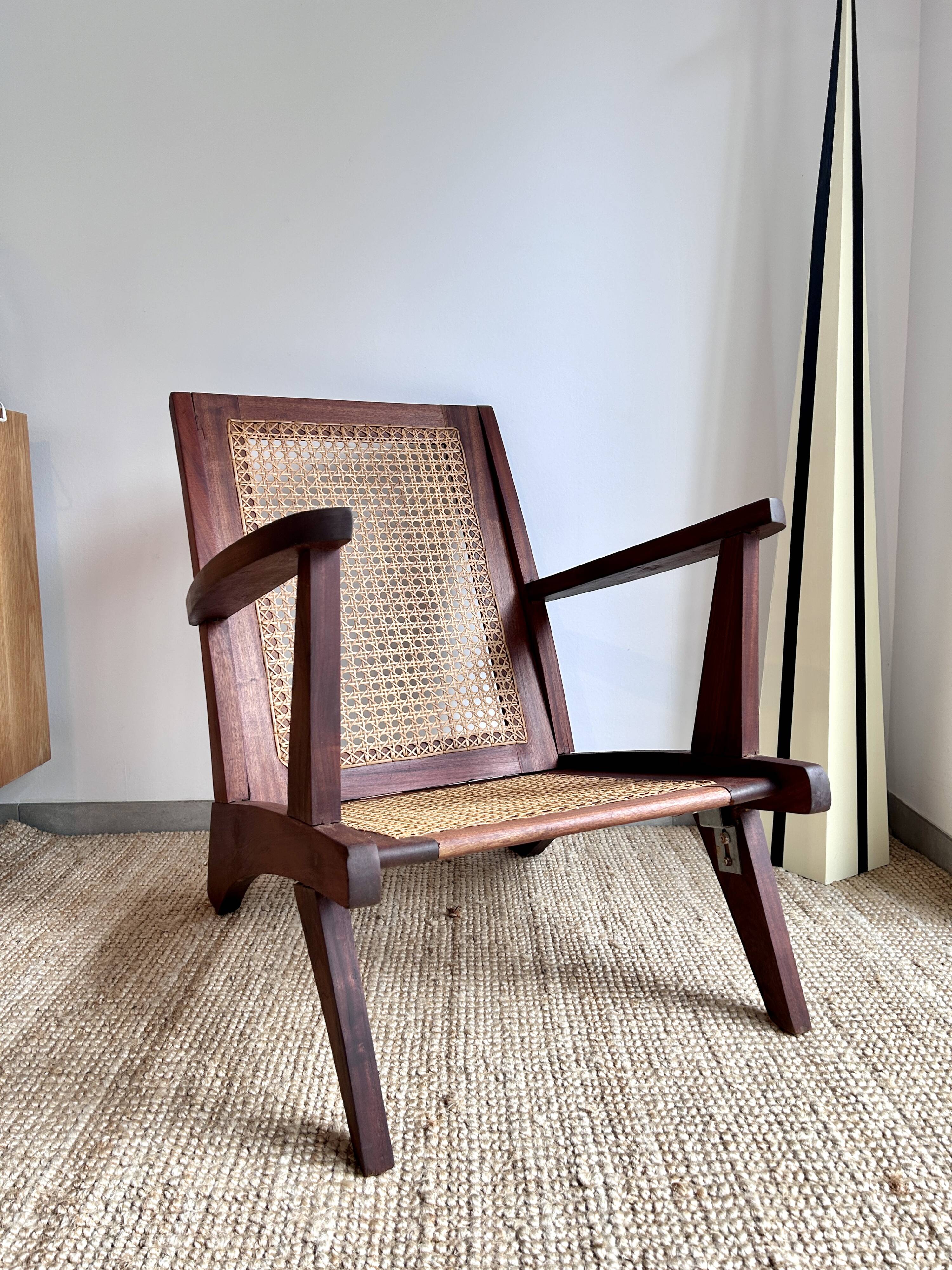 Reconstruction armchair in teak and caning