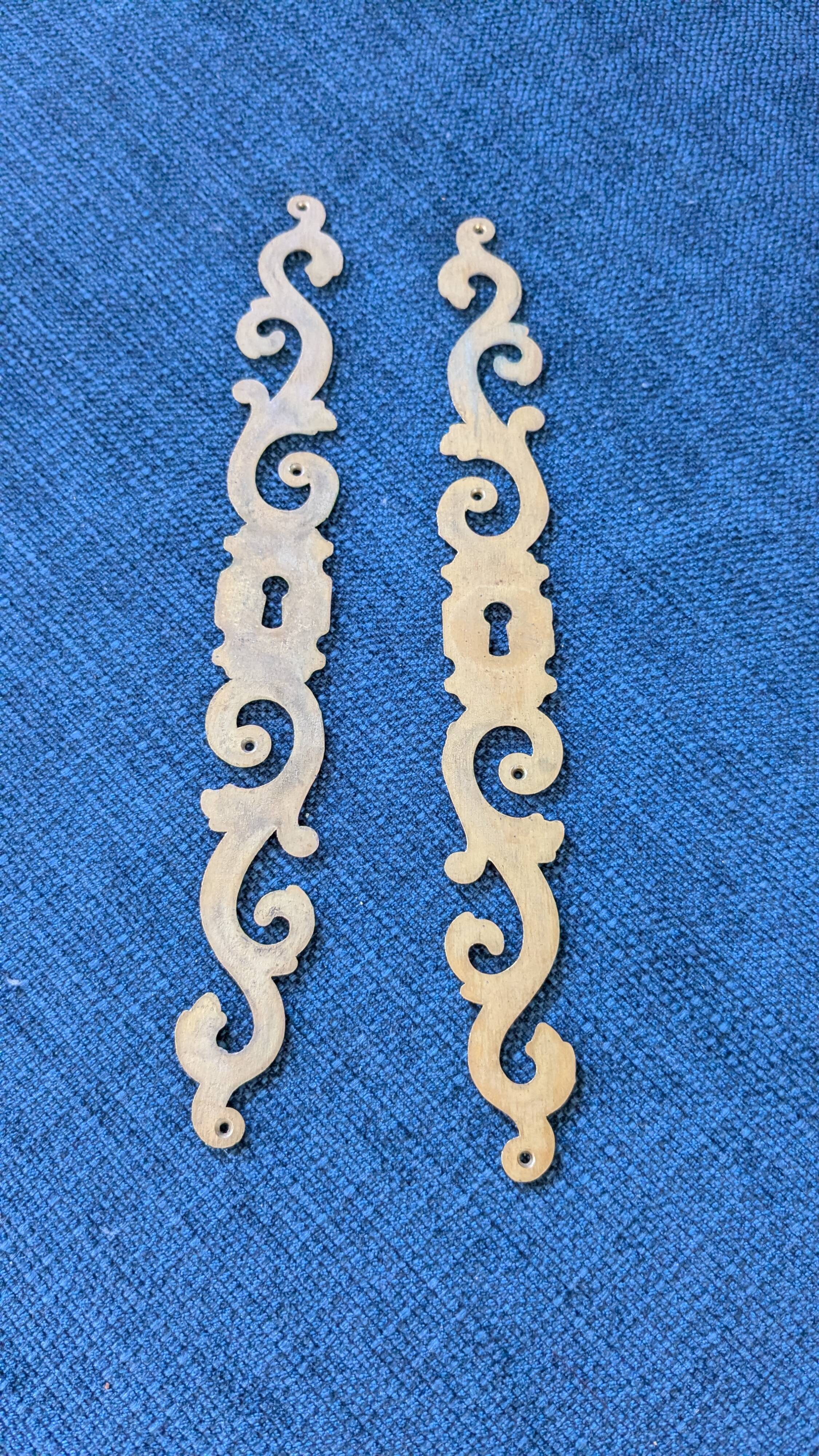 Pair of brass keyholes