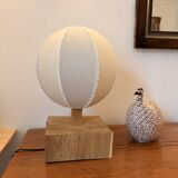Handmade wooden ball lamp on a stand