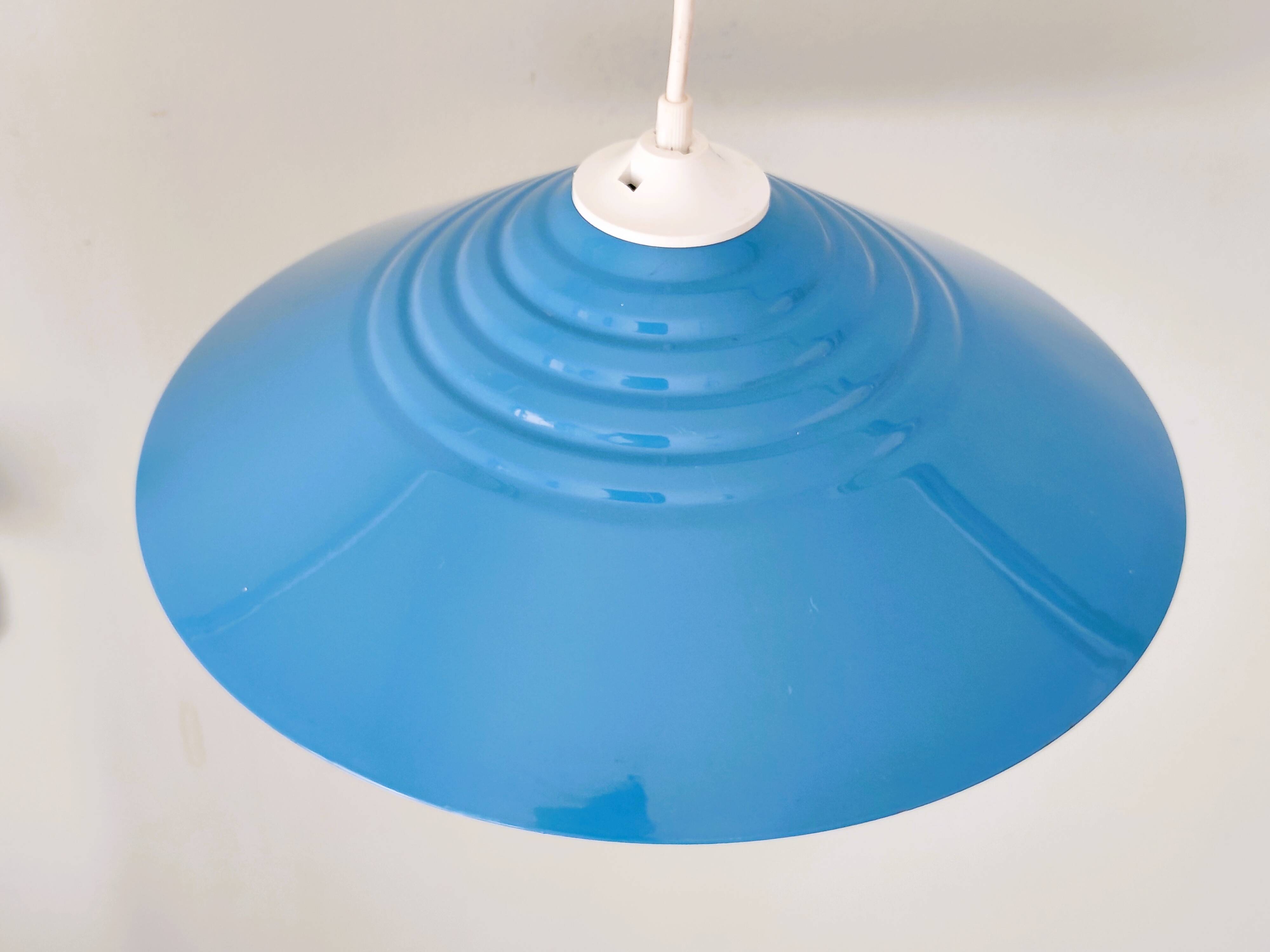 Blue lacquered metal suspension in a 70s/80s style.