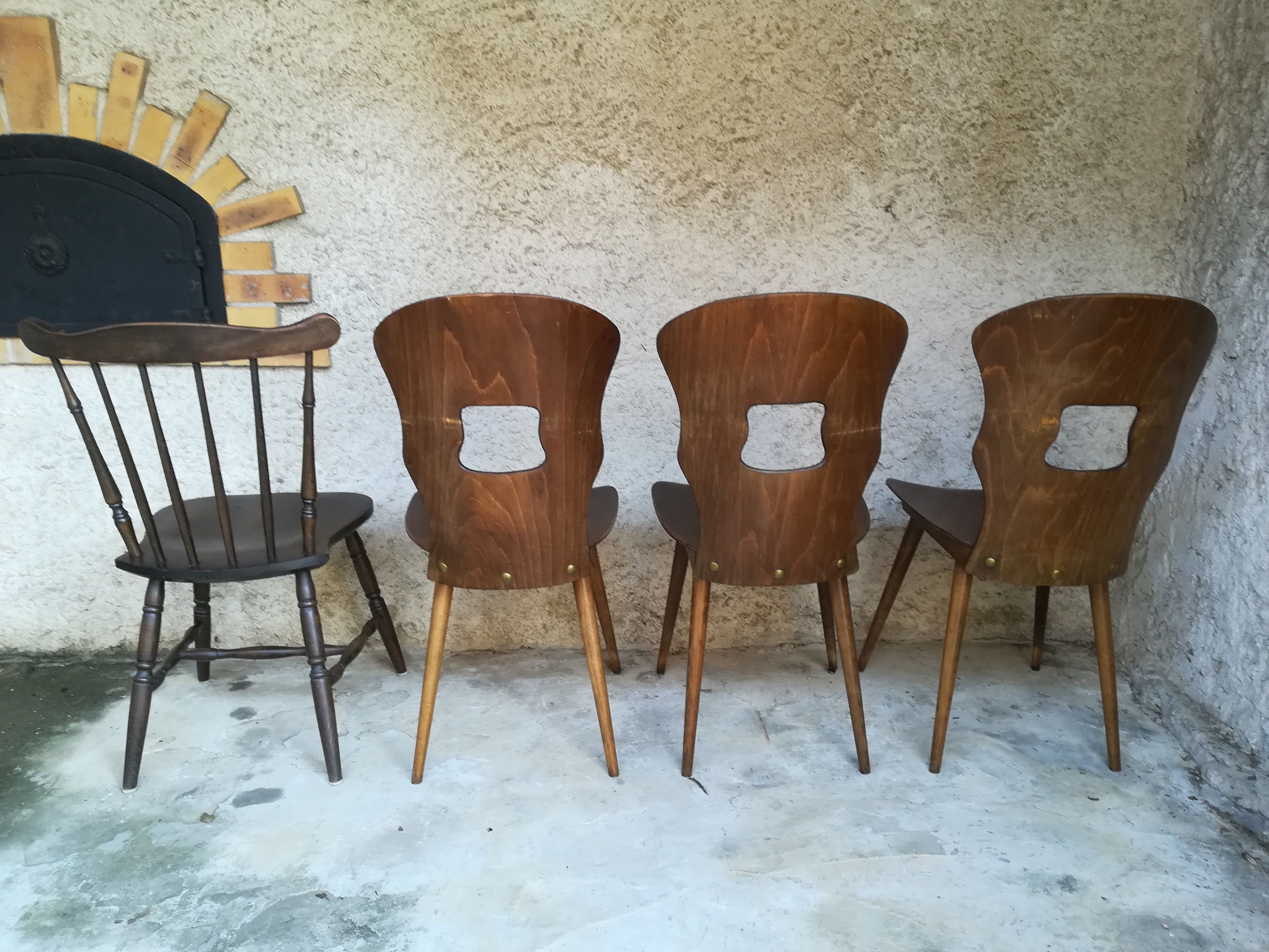 Eight mismatched bistro chairs