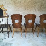 Eight mismatched bistro chairs