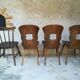 Eight mismatched bistro chairs