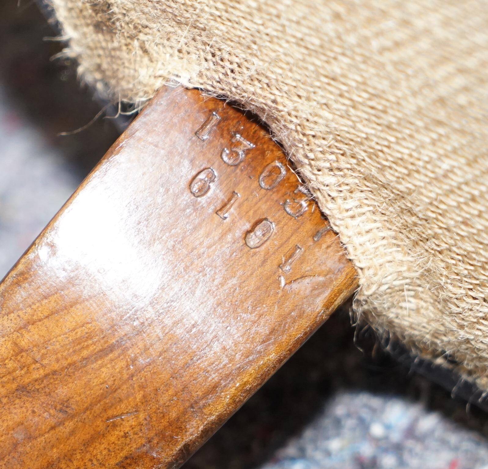 Pair of leather Chesterfield sofas by Howard & Sons