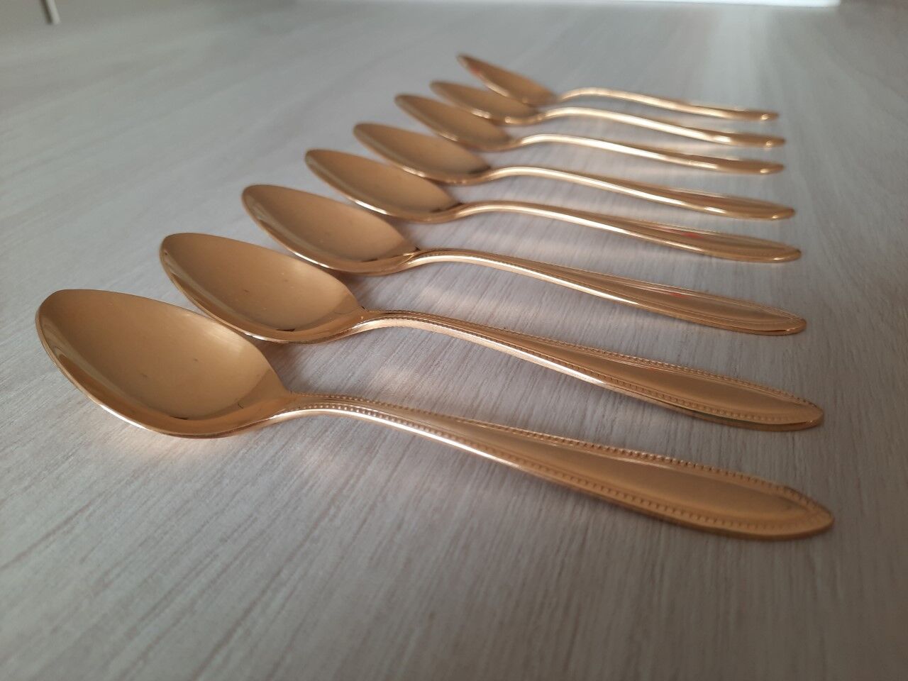 Small golden metal spoons
