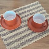 terracotta cups with saucers