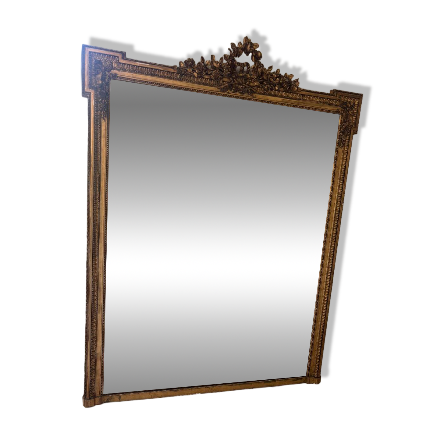 Large mirror from the Napoleonic III era with a floral pediment.