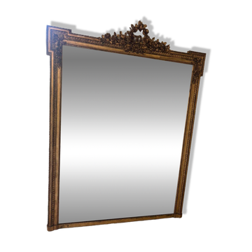 Large mirror from the Napoleonic III era with a floral pediment.