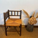 Corner chair in turned wood and straw