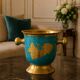Vintage turquoise brass champagne bucket with grape decoration.