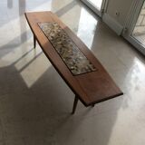 Coffee table with decorative tile.
