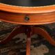 Circular table in solid mahogany and black leather claw base Restoration