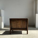 Small low armchair in varnished brown wood