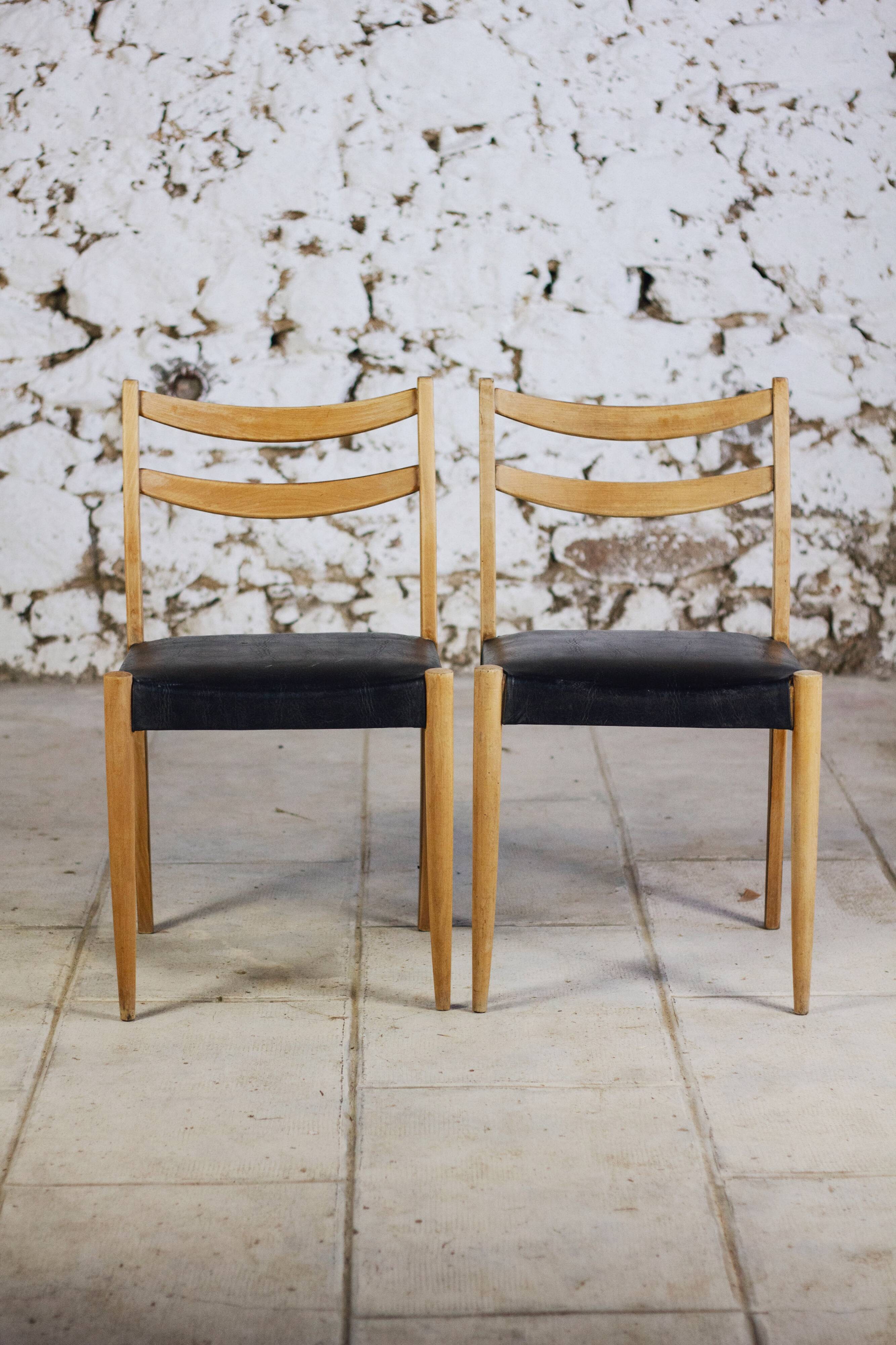 Pair of Scandinavian chairs in teak and faux leather, 1960.