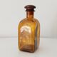 Vintage amber glass apothecary bottle