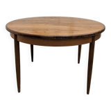 Round and extendable dining table published by G-Plan