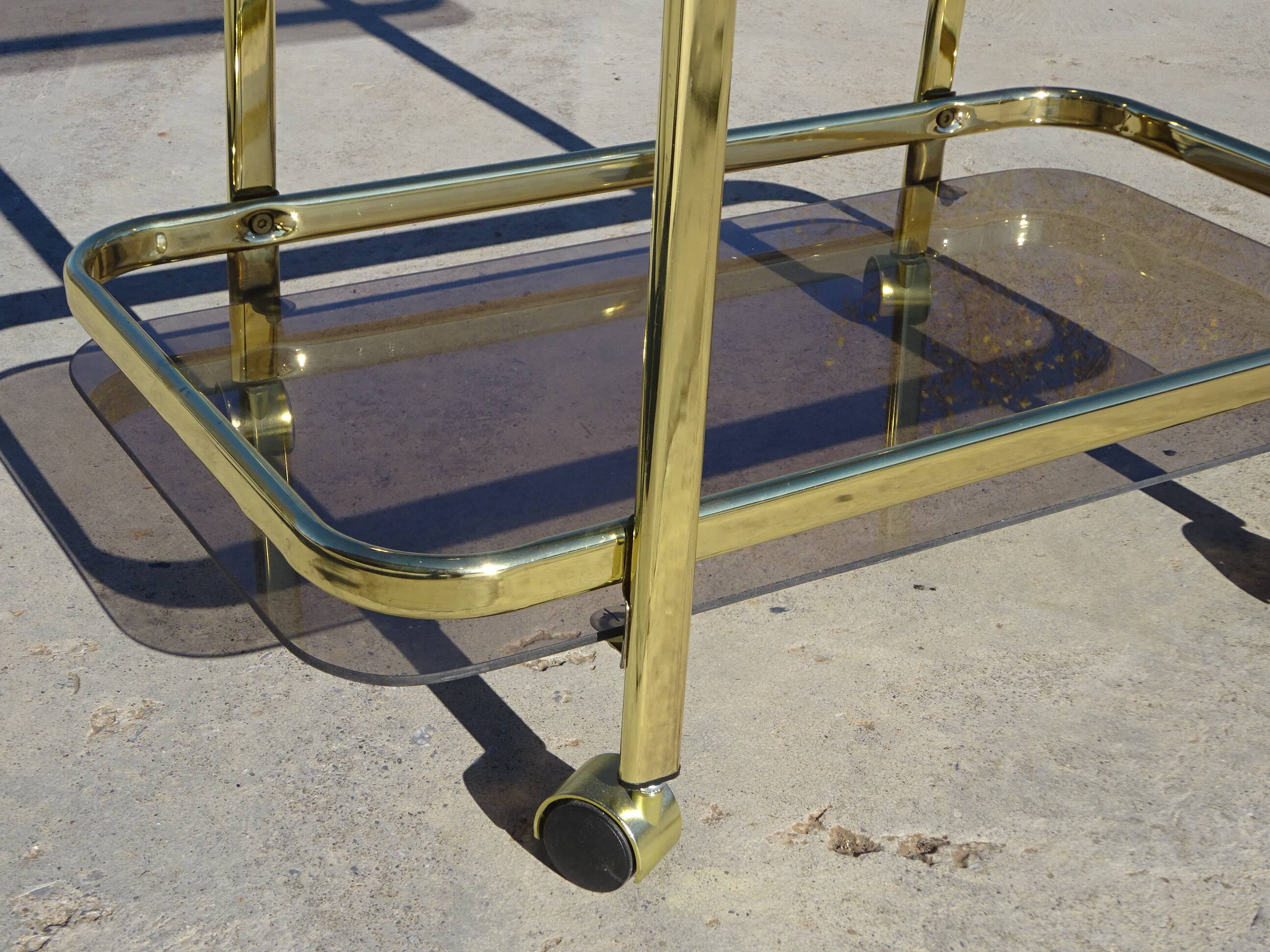 Golden metal and smoked glass dessert table