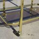Golden metal and smoked glass dessert table