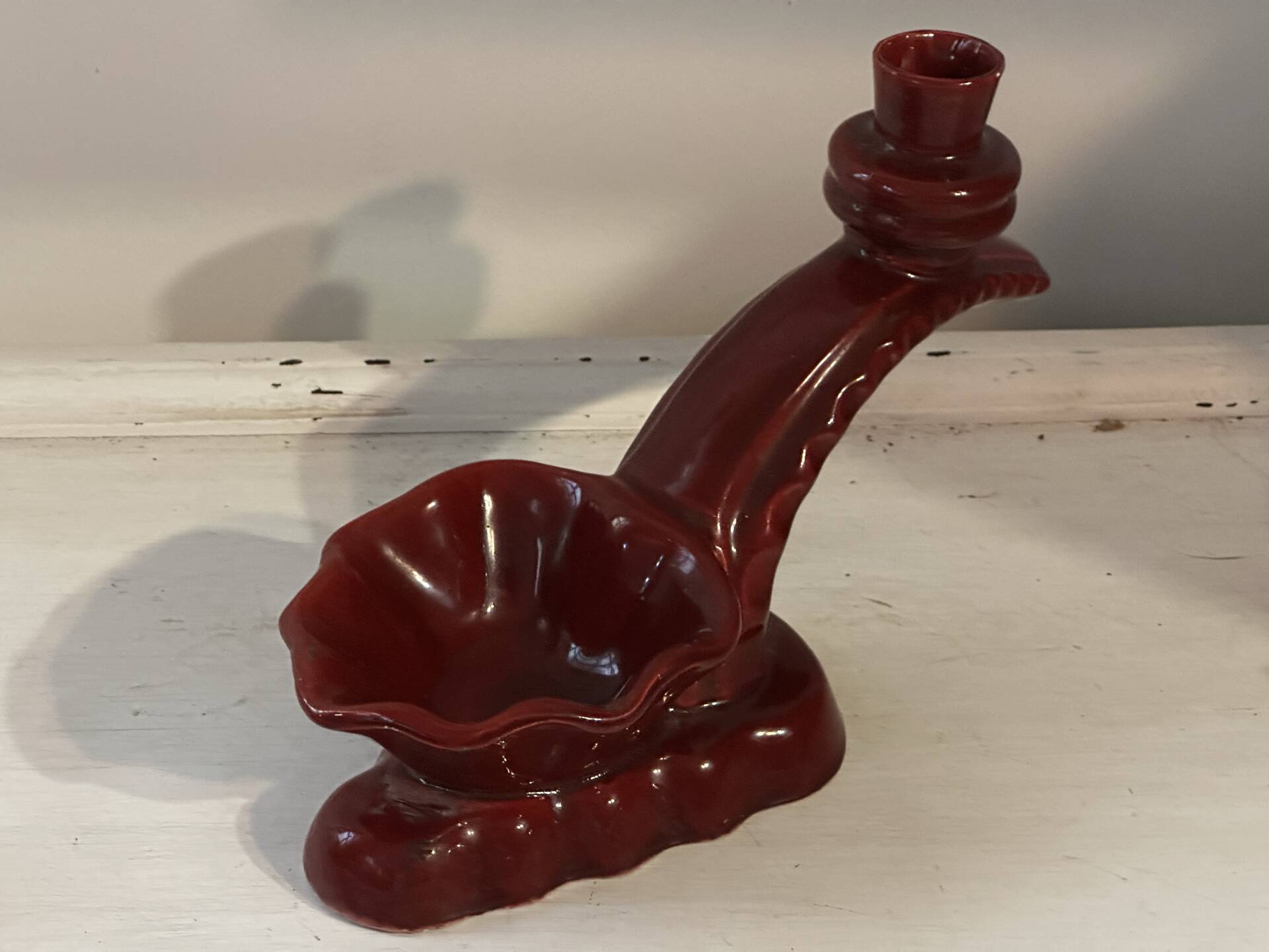 Ruby red ceramic pocket ashtray from Vallauris, numbered.