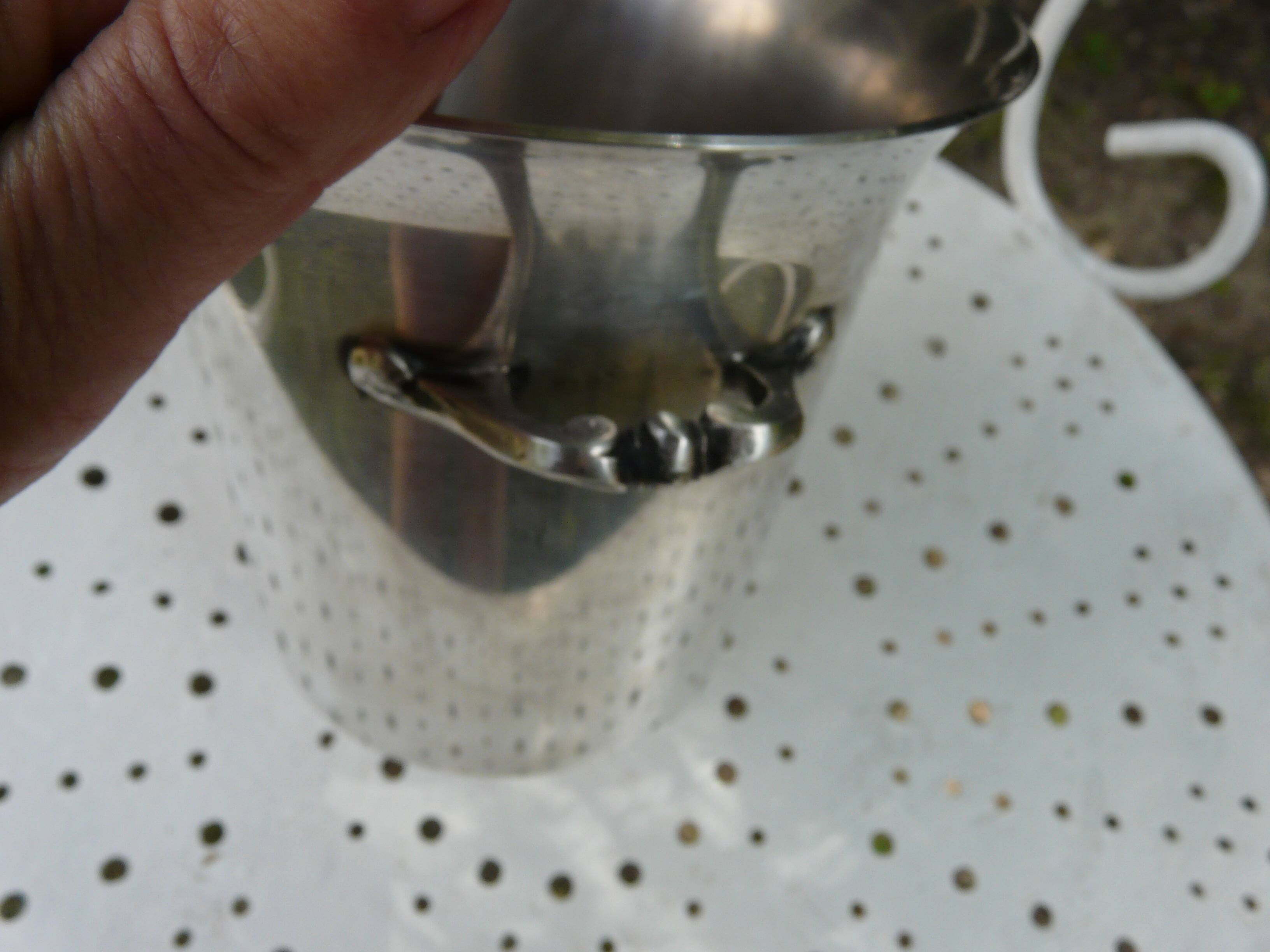 Silver metal ice bucket with its lion's pate tongs