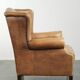 Comfortable cowhide wingback armchair with a timeless English look