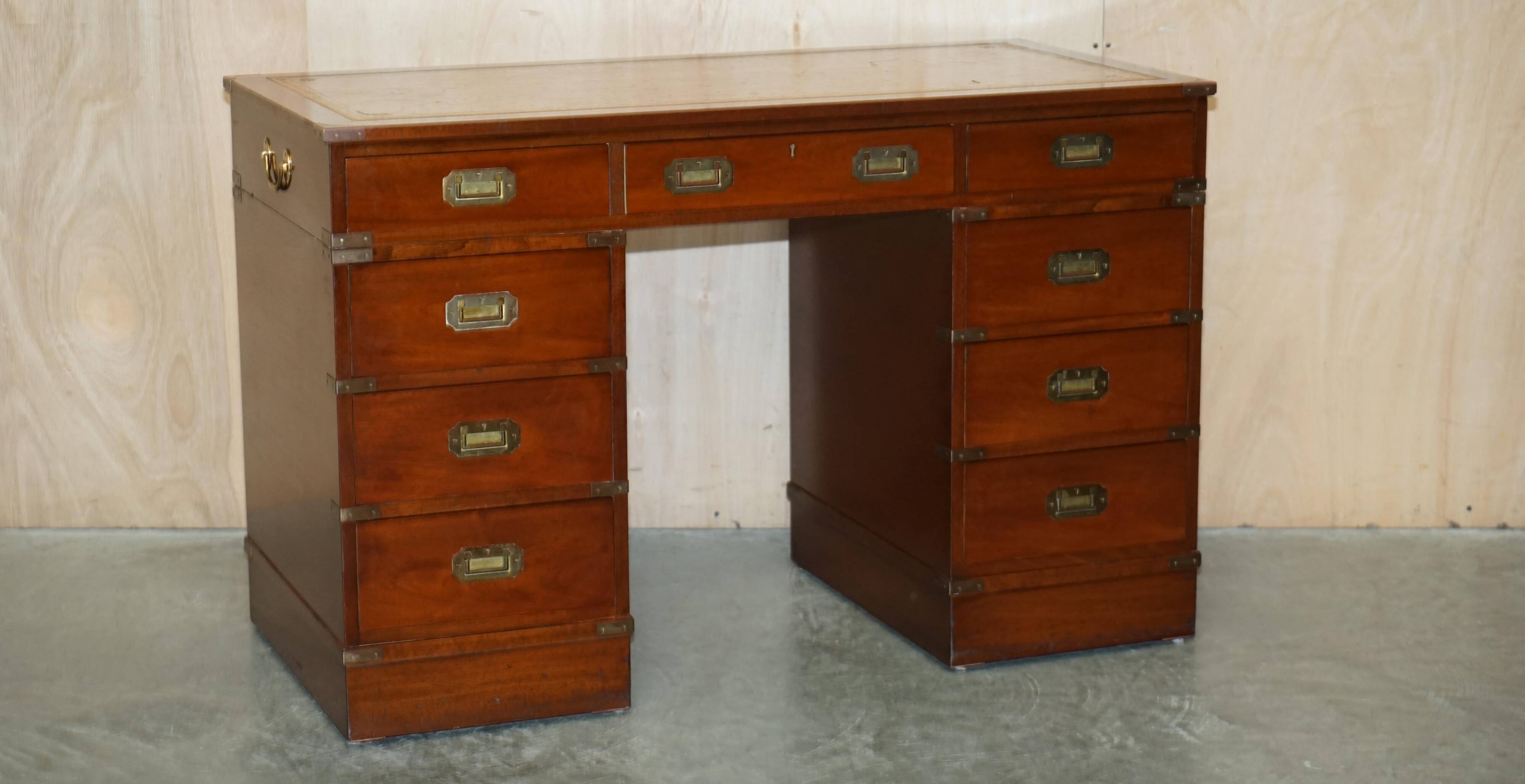Vintage Harrods Kennedy desk in military campaign style with drawers.