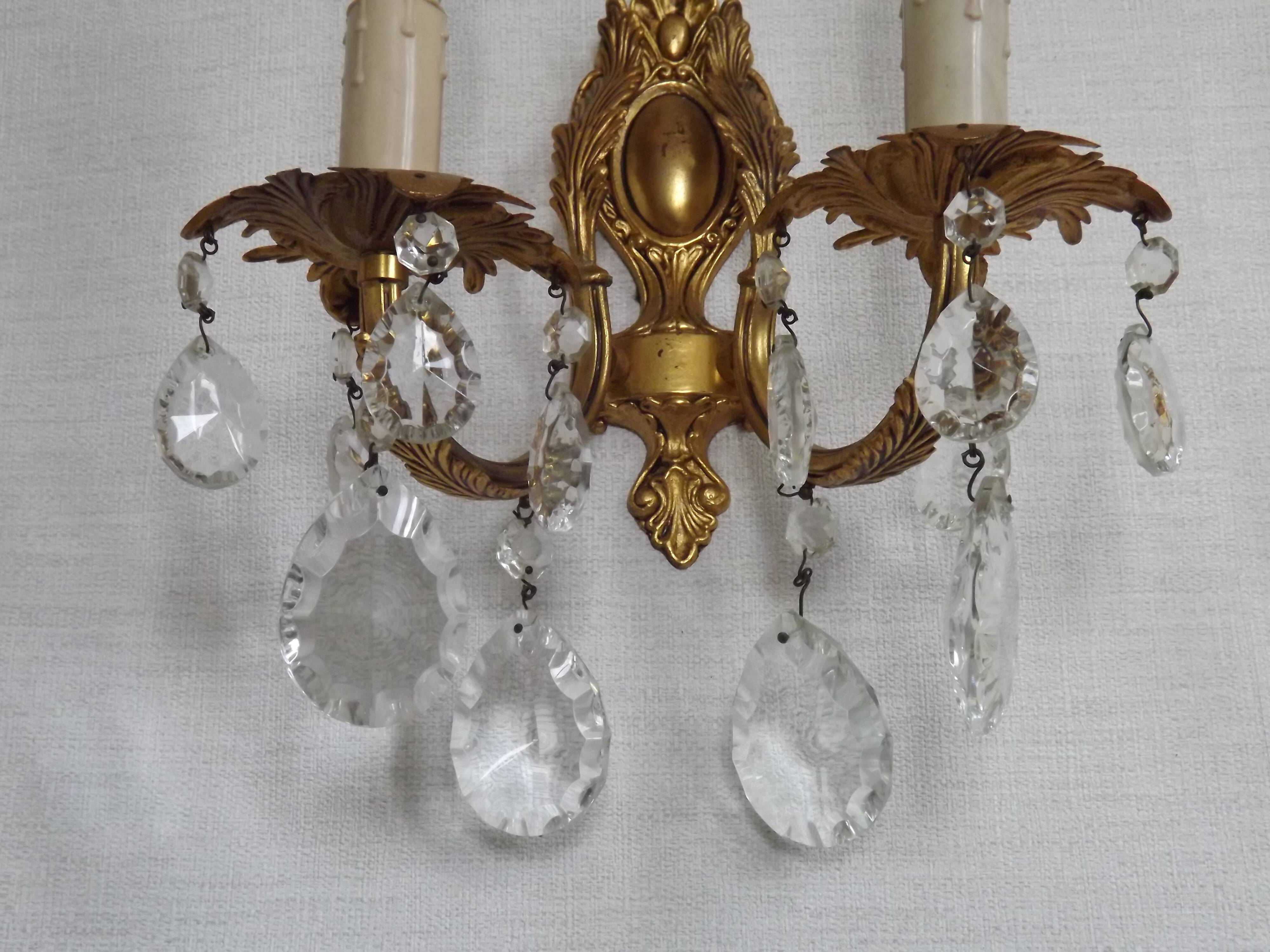 Pair of antique 2-light wall sconces in bronze with crystal pendants, Spain.