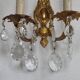 Pair of antique 2-light wall sconces in bronze with crystal pendants, Spain.