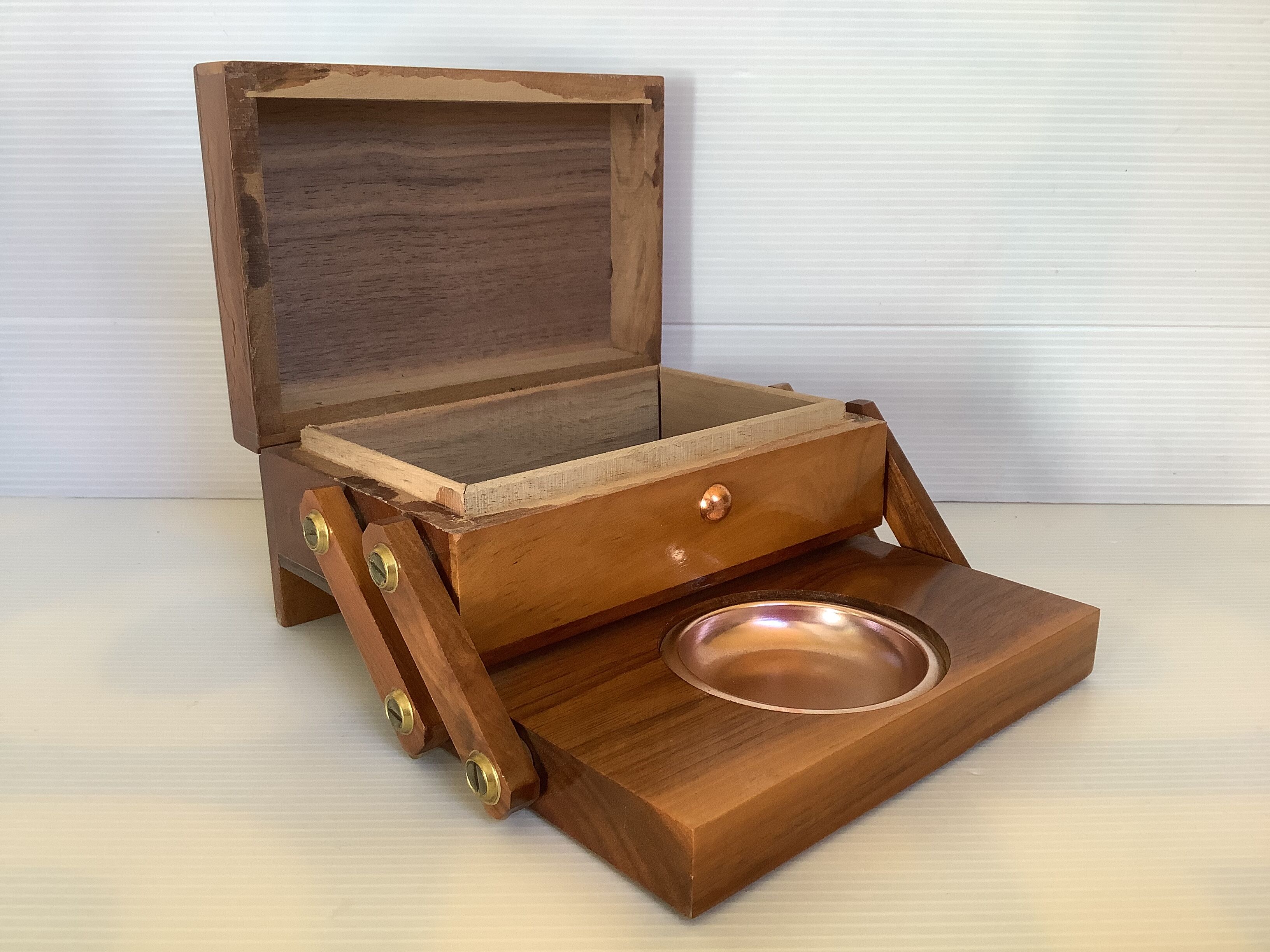 Old wooden cigarette box and ashtray