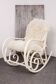 Antique Thonet rocking chair in ivory lacquered bent wood, with a white lamb fur seat.