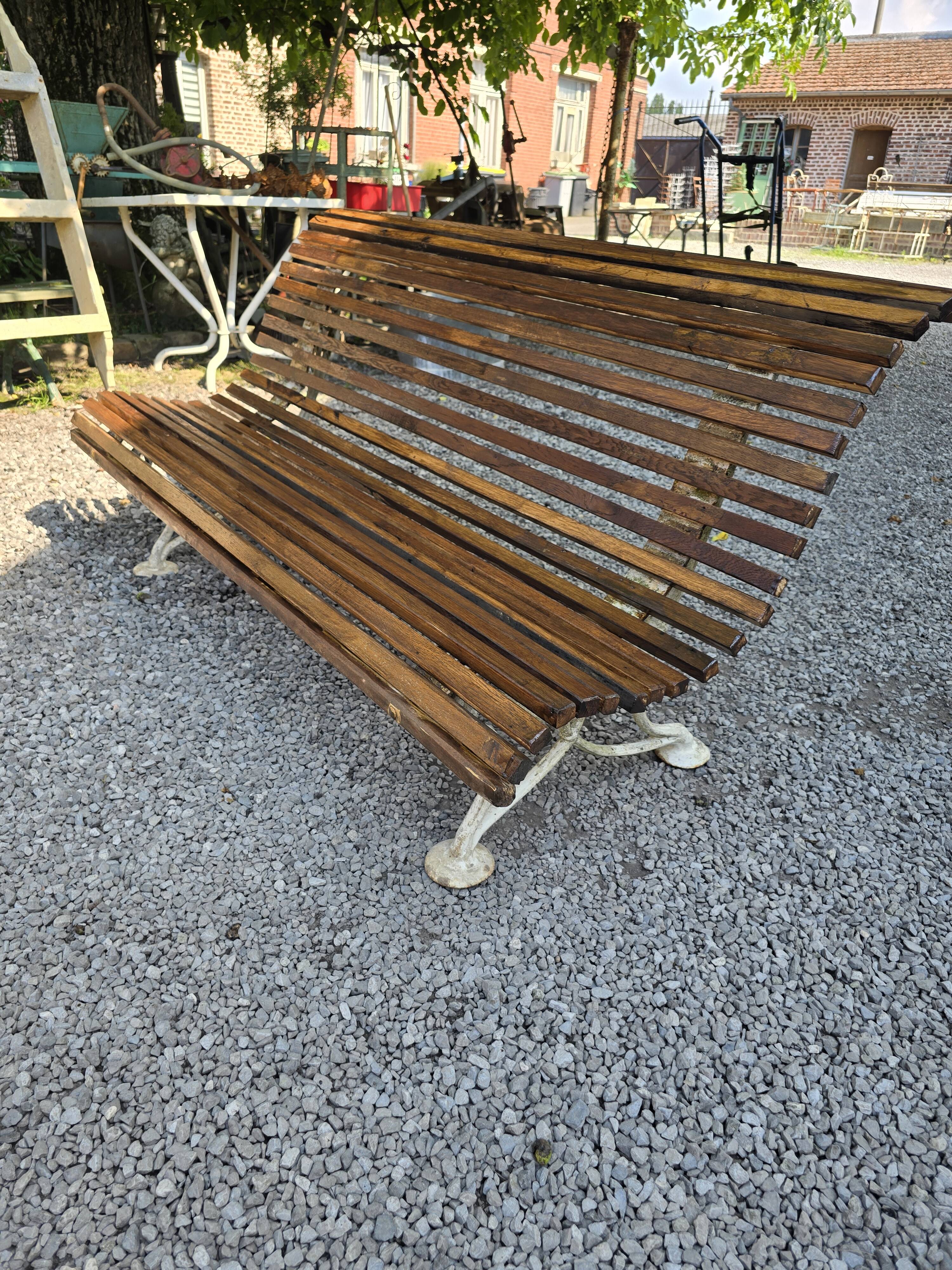 Garden bench with cast iron legs and oak slats