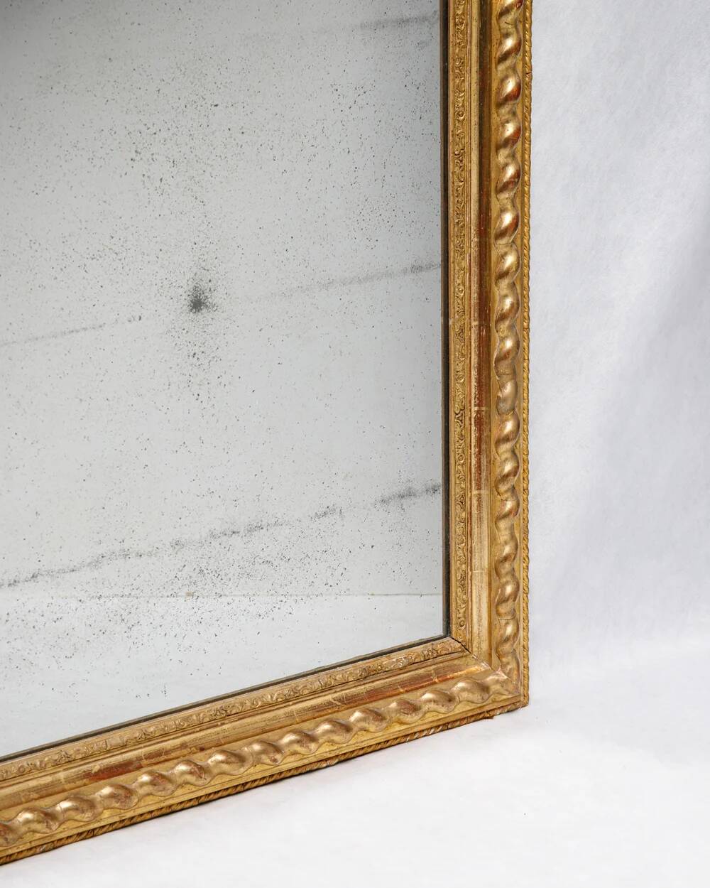 Louis-Philippe mirror with a geometric scalloped frame