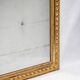 Louis-Philippe mirror with a geometric scalloped frame