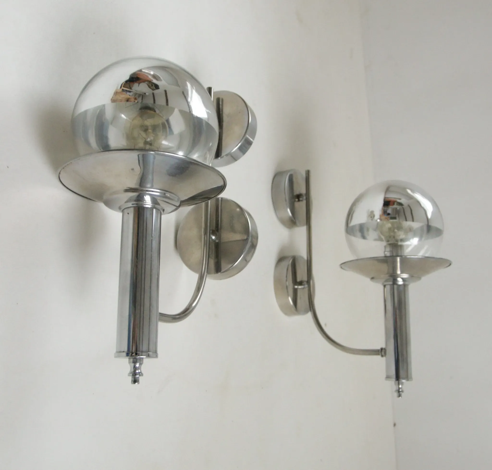 Pair of European mid-century chrome wall sconces with mirrored globe shades