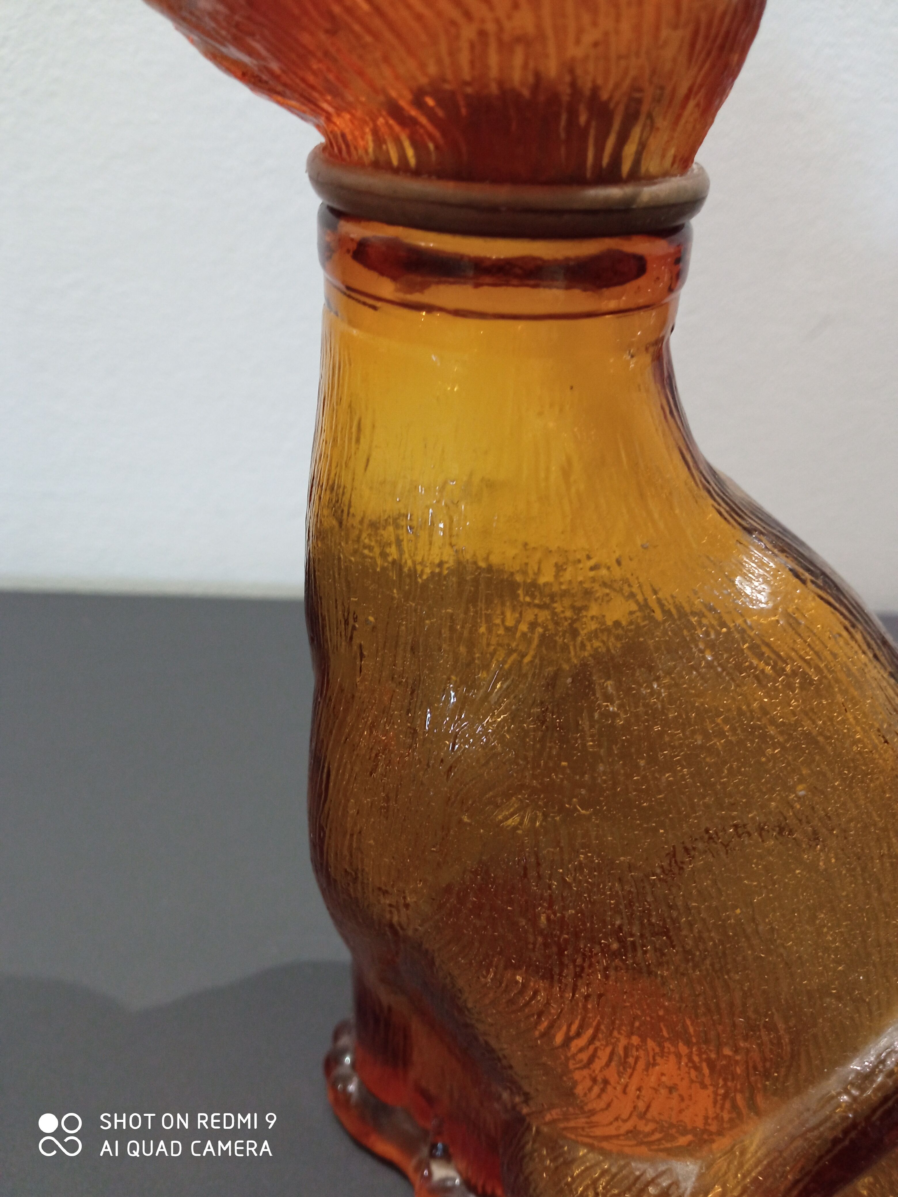 Old bottle in amber glass"cat"
