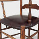 Antique rustic armchair in walnut and leather, 18th century.