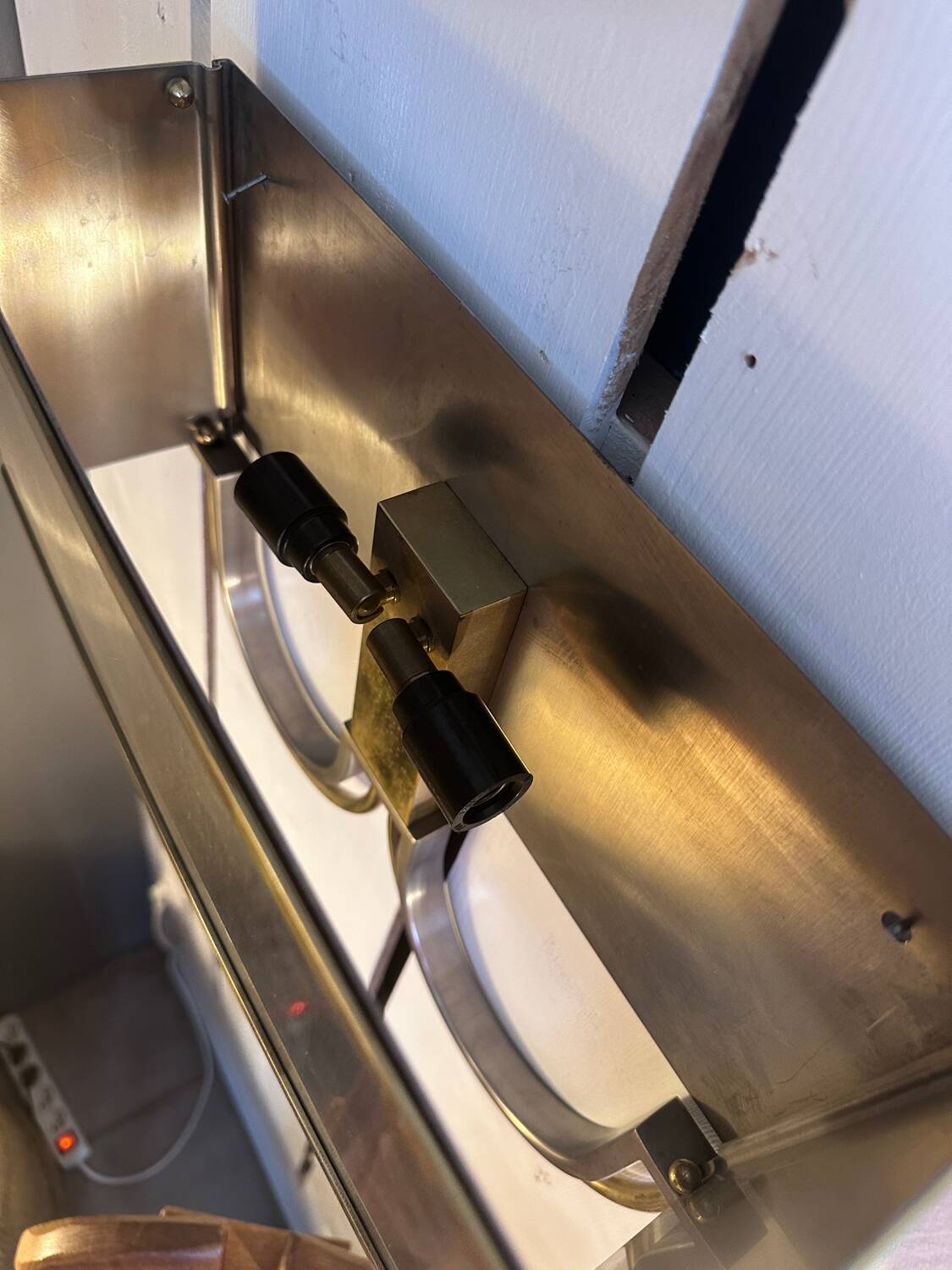 Pair of stainless steel and brass wall lights