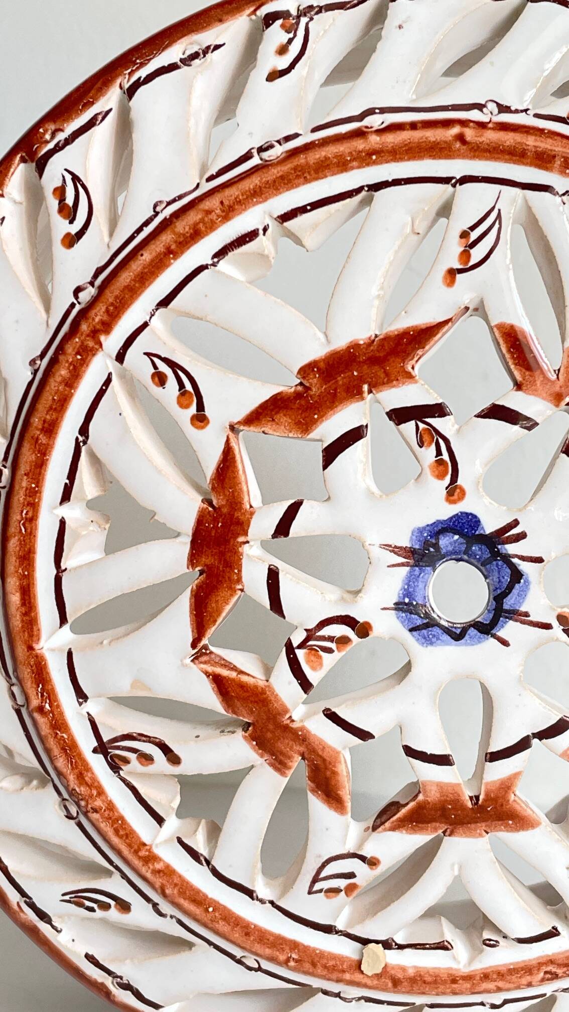 Handmade terracotta wall lamp with blue enamelled center