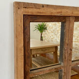 Mirror in old rustic window