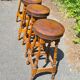 4 old leather and wood stools