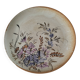 Stoneware plate with hand-painted floral decoration