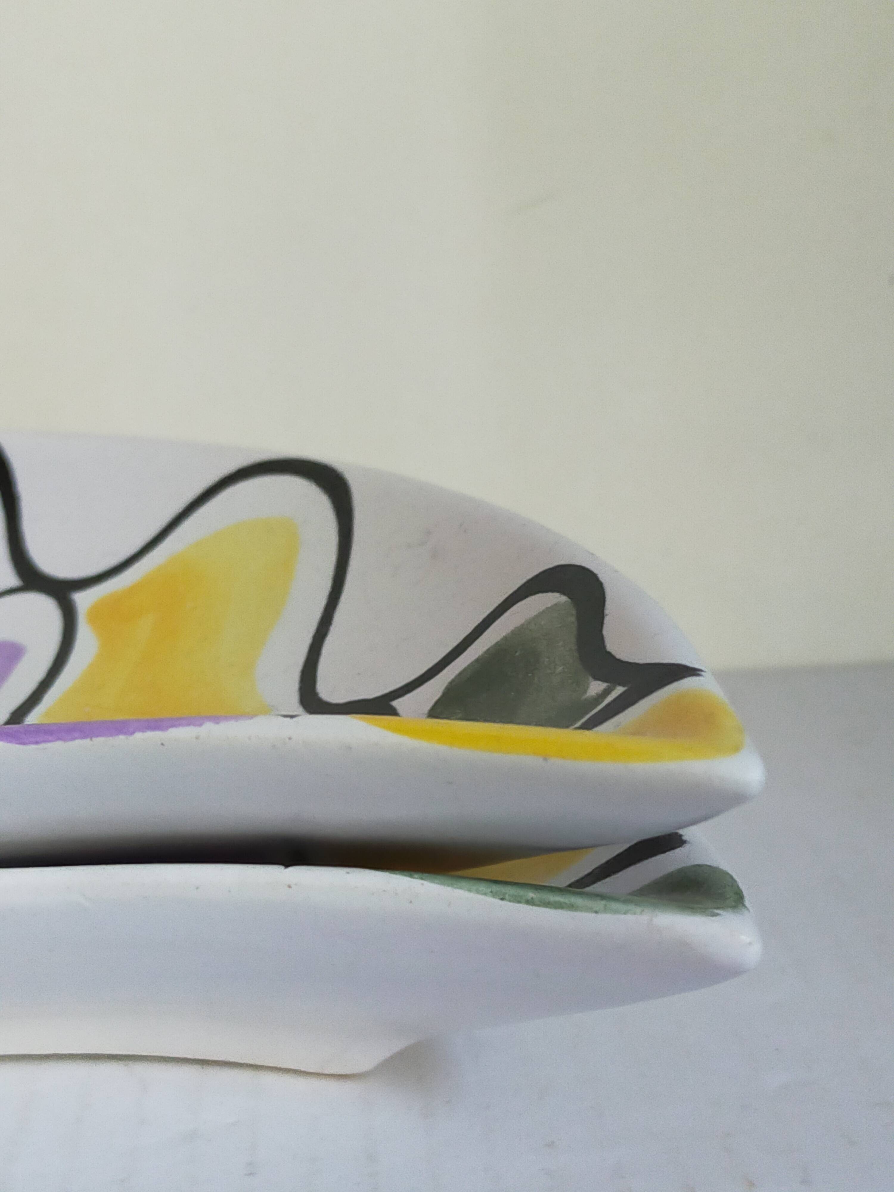 Three vintage free-form ceramic ravine dishes from the 1950s