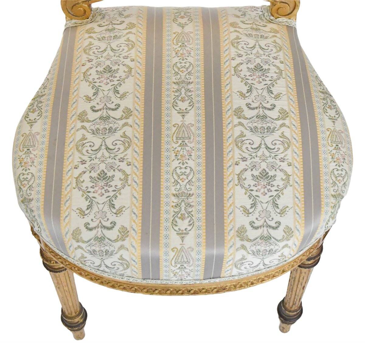 Pair of Louis XVI style chairs in gilded wood.