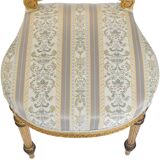 Pair of Louis XVI style chairs in gilded wood.