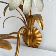 Vintage Hollywood Regency gold metal leaf wall sconce.