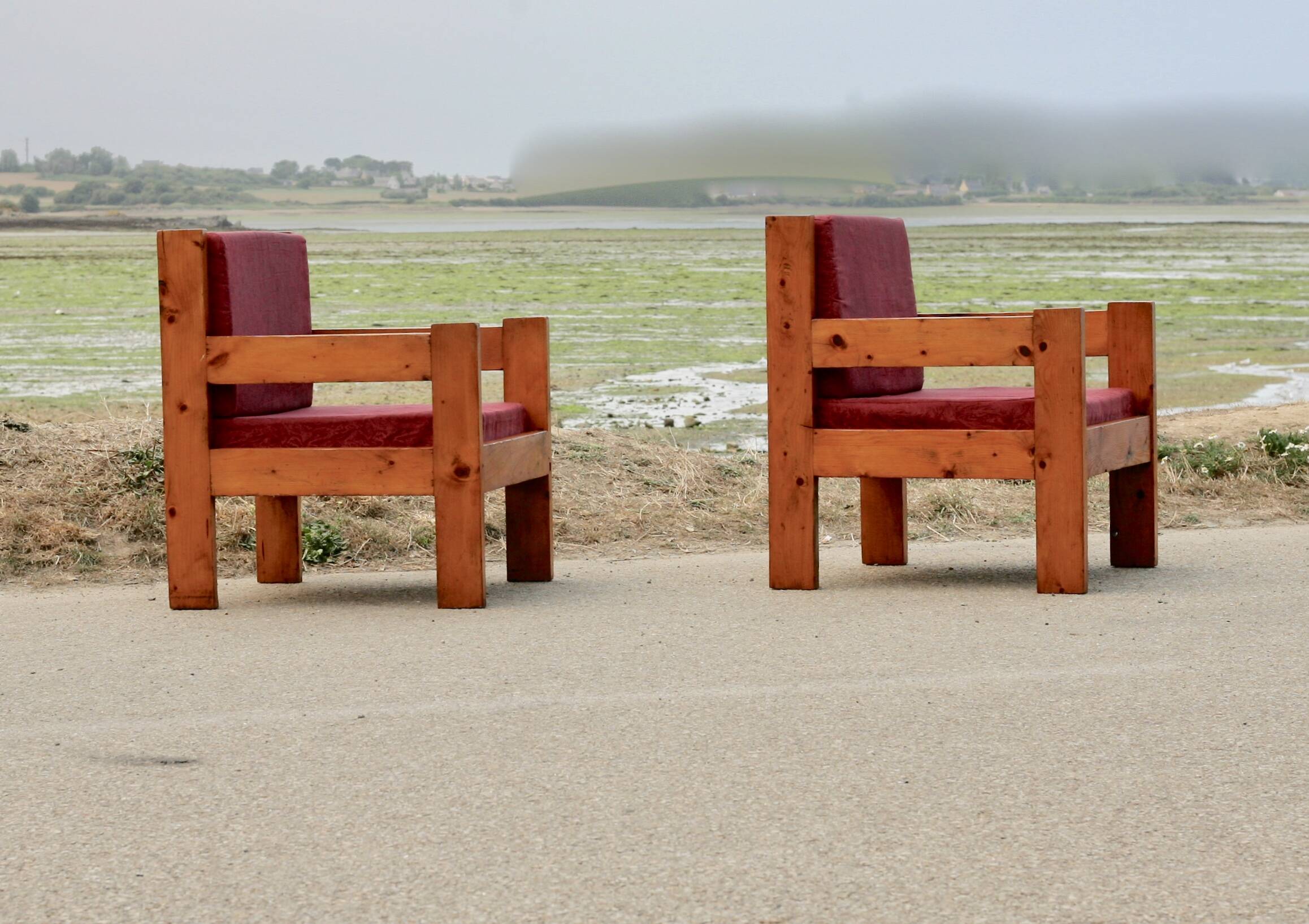 Pair of pine fireside chairs, France, 1960s, "raspberry" cushions