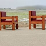 Pair of pine fireside chairs, France, 1960s, "raspberry" cushions