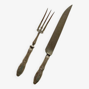 Old serving cutlery leg of meat fork knife in silver metal tableware