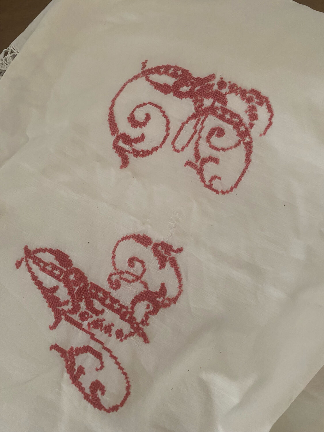 Antique white cotton pillowcase with crochet and monogram.